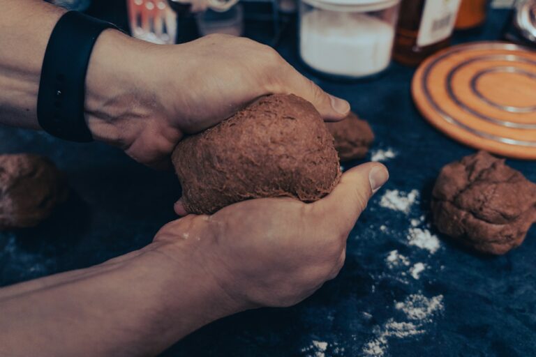 a person holding a piece of food in their hands
